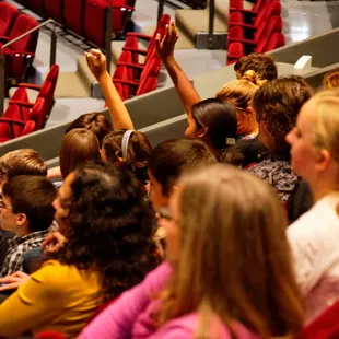 a large group of children in a theater