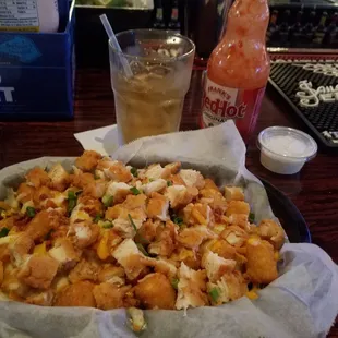 The amazing Loaded Tater tots with fried chicken,cheddar cheese and bacon!