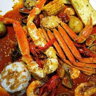 crab legs, carrots, and potatoes
