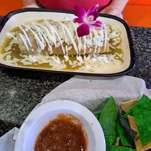 Carne Asada wet burrito with green sauce.