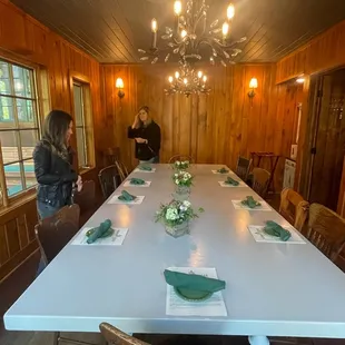 a dining room with a table and chairs