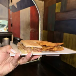 a person holding a plate of food