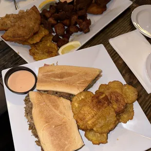 a plate of fried fish and a sandwich