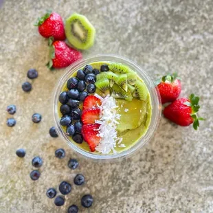 a smoothie with kiwi, strawberries, and strawberries