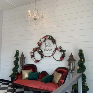 a red couch and a chandelier
