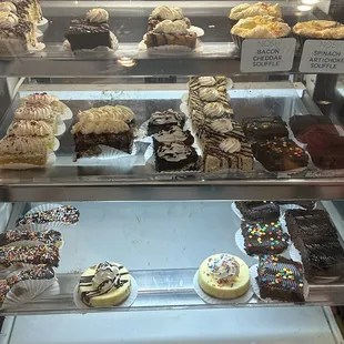 a display case with a variety of pastries
