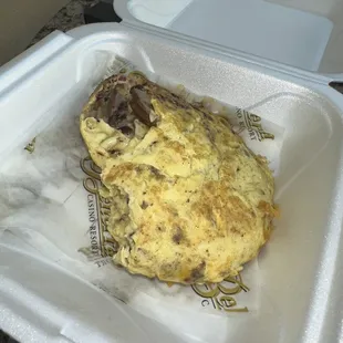 an omelet in a styrofoam container