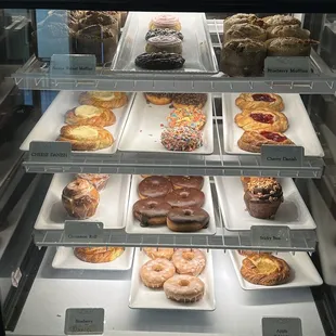 a display case filled with different types of donuts