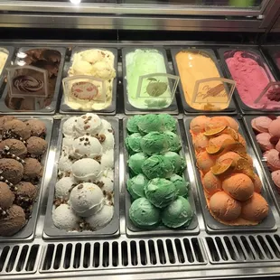a variety of ice creams in a display case