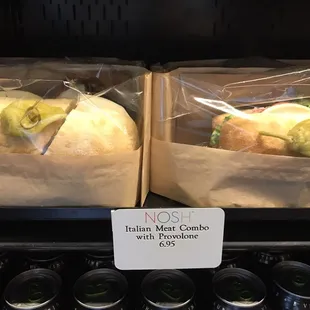 two bags of bread with pickles in them
