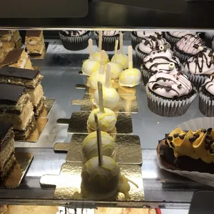 a display case with a variety of desserts