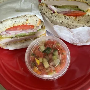 Oven Roast Turkey Sandwich Lunch on Rye Bread with a side of Israeli Salad