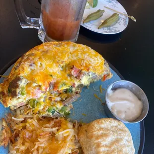 Cheesy hash browns, omelet with everything and biscuit with gravy. Bloody Mary