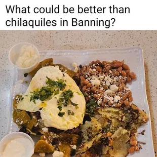 Chilaquiles with chorizo,  3 eggs over easy and beans and potatoes