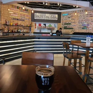 a pint of beer on a table