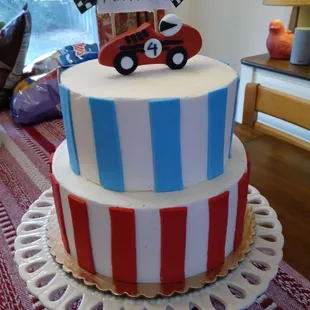 a birthday cake with a race car on top