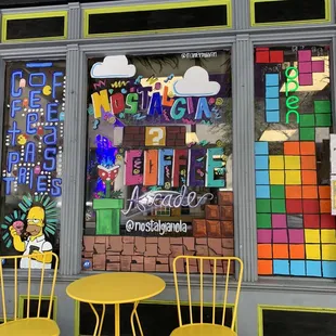 two yellow chairs and a yellow table