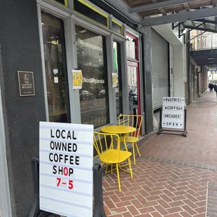 a sign for a local coffee shop