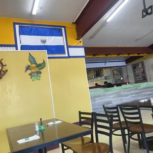 Left side of dining area. Kitchen behind wall.