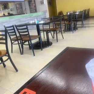 2 rows of tables. Flatscreen in center.