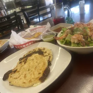 2 pupusas, tropical salad (17.25) green salsa in center. NO CURTIDO!