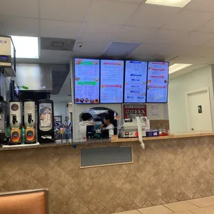 a restaurant counter and menus