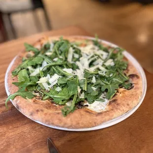 mushroom pizza? It&apos;s somewhere under all that arugula.