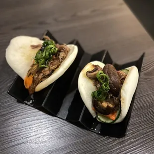 two buns with meat and vegetables