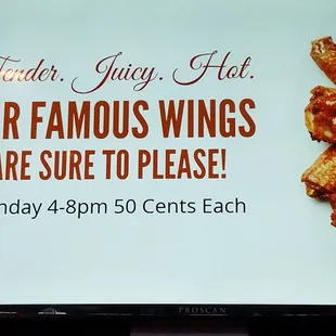 a tv screen with a sign that says, our famous wings are sure to please