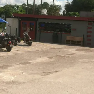 two motorcycles parked in a parking lot