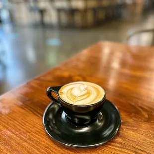 a cup of coffee on a saucer