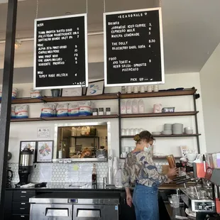 a woman working in a coffee shop