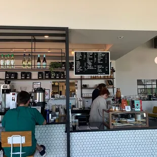 two people sitting at a counter