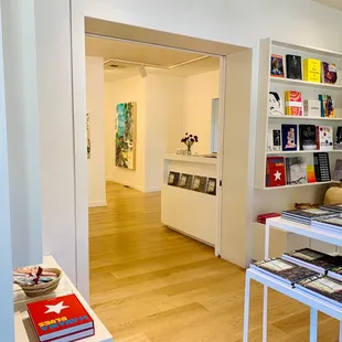 a view of a room with a bookcase and a table with books on it