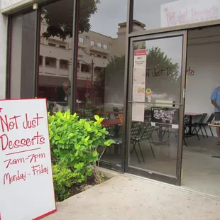 a sign in front of a restaurant