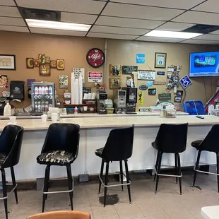 a counter and chairs