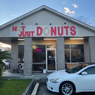 a car parked in front of a donut shop