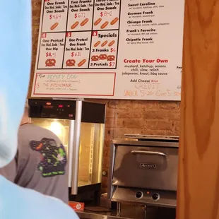 Menu and making hot dogs and pretzels