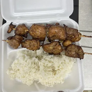 Chicken skewers with rice  $13.50. Plain skewers $5.00/ stick
