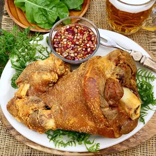 Crispy Pata : Pork leg boiled in home made seasoning and deep friend to perfection . Good for 3-4 people . Price range from $32, $35, $39