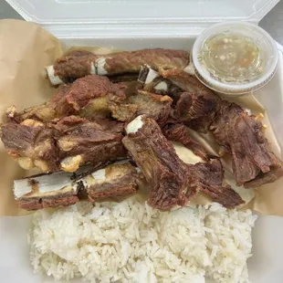 Crispy Pork spare ribs: Seasoned and boiled and deep fried comes with rice and dips. $13.50