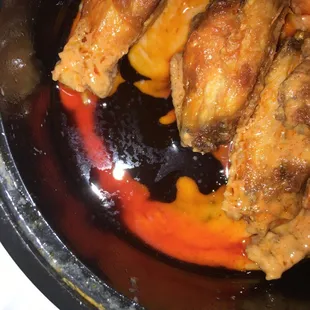 Gross oil inside container of wings. Lady was so rude.