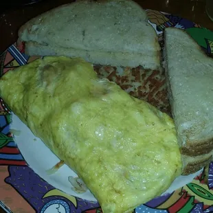 Meat lovers omelet with white toast and hash browns