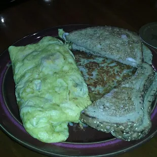 Monster omelet with wheat toast and hash browns