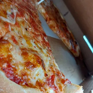 a slice of pizza in a box