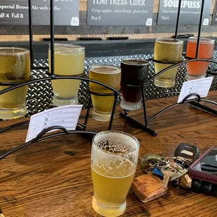 a row of beer glasses on a table