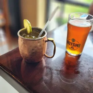 a copper mug with a lime wedge and a copper mug with a lime wedge