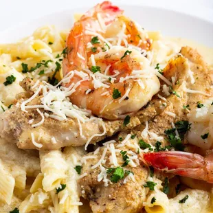 a plate of pasta with shrimp