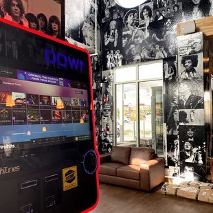 the inside of a bar with an arcade machine