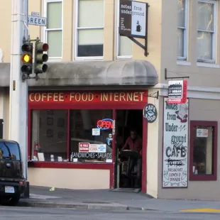 a coffee shop on the corner of a street